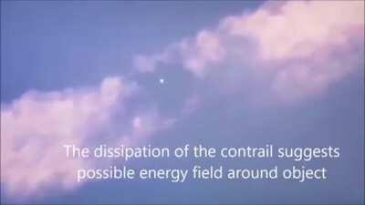 UFO clears contrail left from airplane then leaves