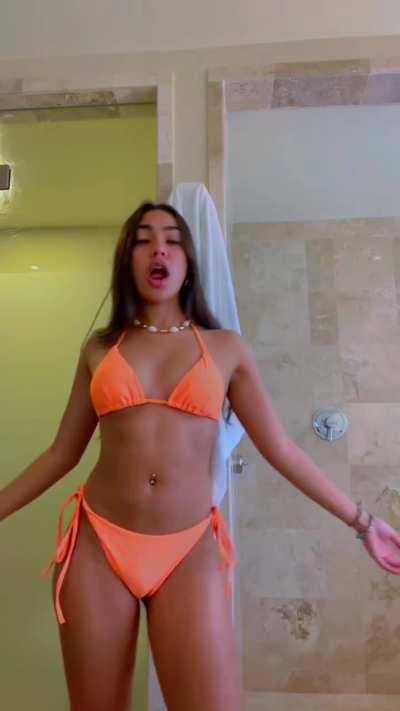 Glowing in orange bikini