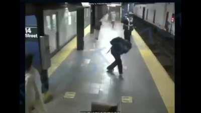 Video shows homeless man shove female passenger onto NYC subway tracks