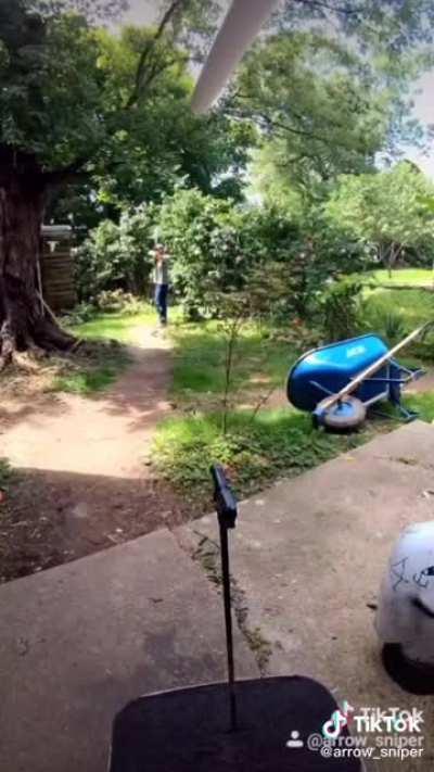 Man shoots an arrow through a 9mm handhun barrel