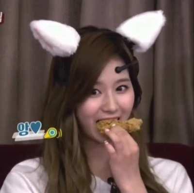 Sana eating fried chicken