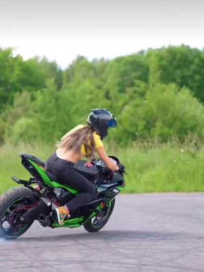 Woman demonstrates extreme motorbike skills