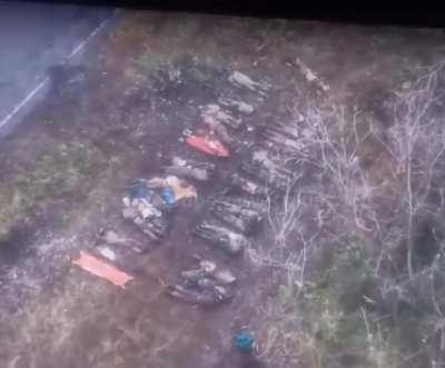 A cluster of dead Russian soldiers were just discovered on the ground by a Ukrainian reconnaissance drone.