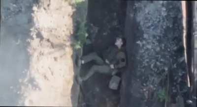 UA drone drops a grenade into a Russian trench, wounding one soldier and forcing another to choose rescue a drone over his comrade. These days. Music from source