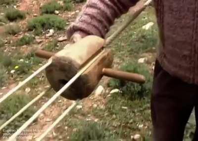 Smashing hemp fibres and braiding a traditional hemp rope.