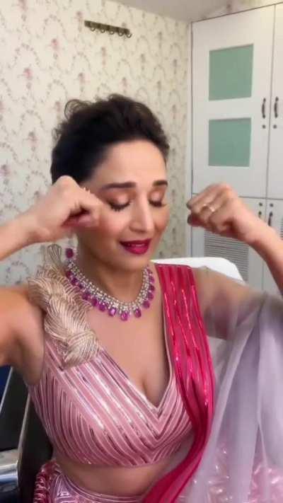 53 years old Madhuri Dixit showing her delicious milf cleavage [gif]