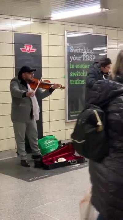 Recently saw these guys at a TTC subway station. At a first glance the music seemed very suspicious. Several violinists have now confirmed that these guys are an absolute fraud. It was sad to see upwards of 60 people circled around them, many giving them 