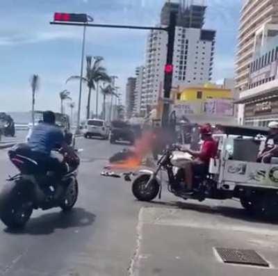 Guy revs bike to flames