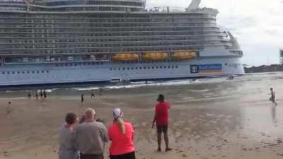 Large cruise ship, Harmony of the sea, causes a huge water displacement when passing by the coast and with that, a small tsunami like effect. 