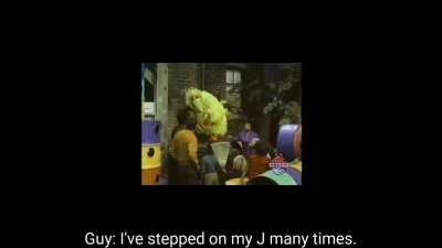 Big Bird steps on a J