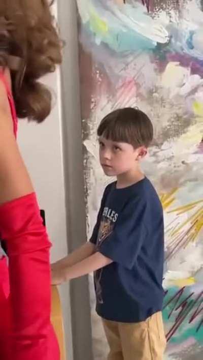 Kid gets caught watching a model get ready