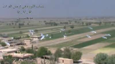 Opposition cameraman records Syrian Army air burst incendiaries as they fall on the village of al-Mariyah - 2013