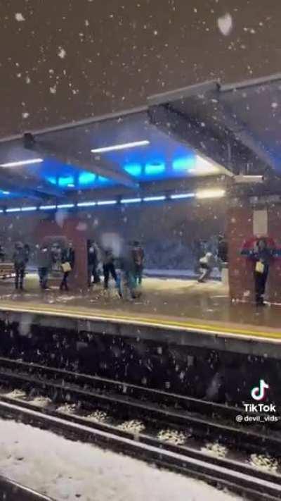 Snowball fight at west ham station, london.