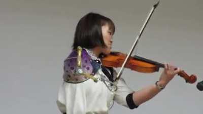 A one-armed woman with a prosthetic arm plays the violin. YOLO you only live once!