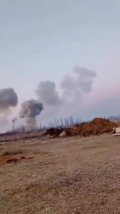 Ukrainian soldiers trying to shoot down Russian missiles with small arms fire.