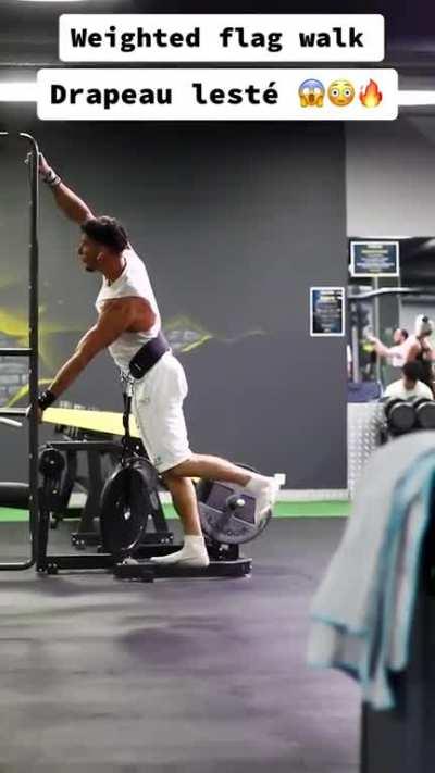 Weighted human flag walk - this guy's core strength is incredible