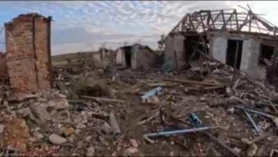 Ukrainian soldiers hoist the Ukrainian flag over liberated Andriivka in the Donetsk region