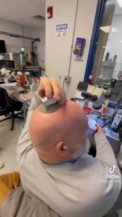 Sticking a suction cup on their coworkers head