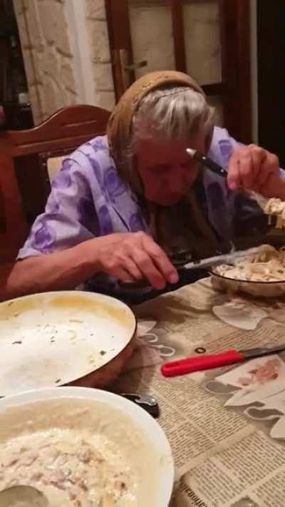 Grandma eating pasta