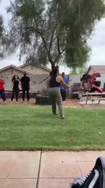 To bust open the piñata with a stick