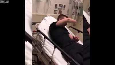 Cop Assaults Man in Hospital Bed