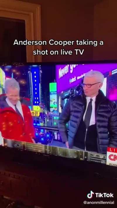 Anderson Cooper taking a shot on Live Tv