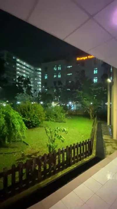 Warm tropical rain at night in Singapore