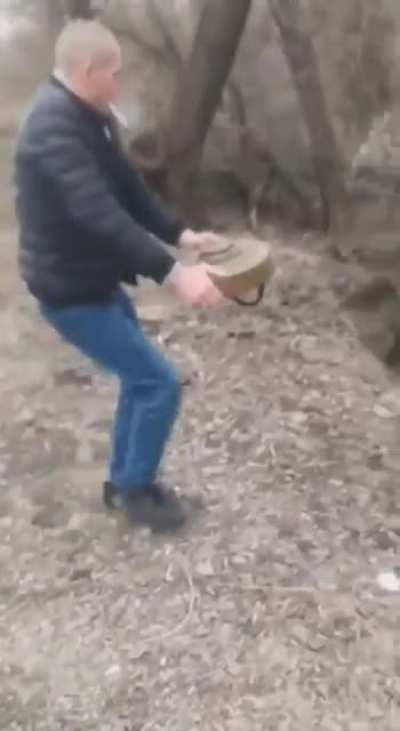 Just a random Ukrainian guy removing landmine from the road with his bare hands. Berdyansk, Ukraine