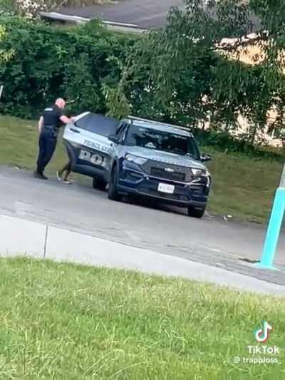 On duty cop climbs into the back of his car with an unknown woman.