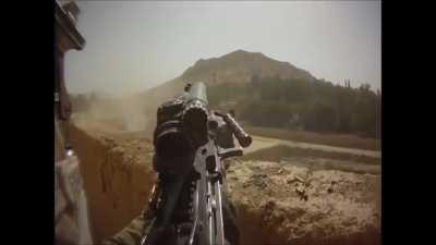 US infantry in Afghanistan firing back at incoming fire, long bursts from an M249 SAW