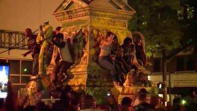 Standing right in front of a 900 lb statue as it's being pulled down