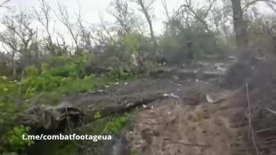 Ukrainian soldiers of the 3rd Assault Brigade storm Russian positions near Bakhmut.