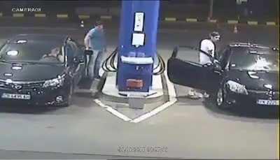 Guy smokes at a gas station. Clerk puts it off big style