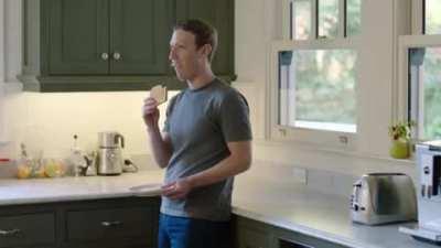 Mark Zuckerberg eating toast like a normal human being.