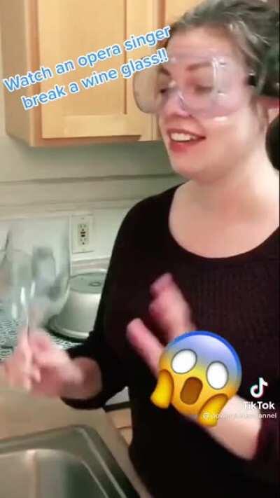 An opera singer attempts to break a wine glass