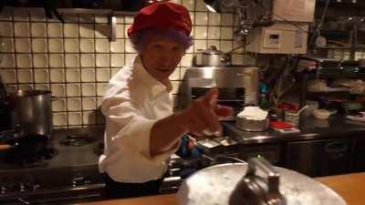 Chef Motokichi displaying his skill in cooking &quot;Omurice&quot;, a notoriously difficult way of preparing omelette over rice. 