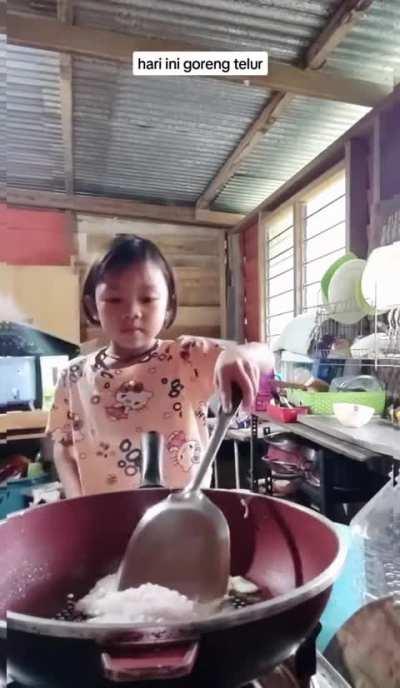 Kid frying an egg with a twist