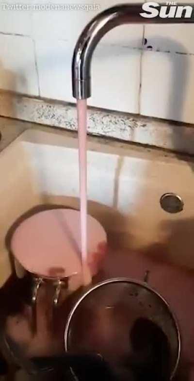 Red wine flows from water taps in Italian village after a technical fault at a local winery