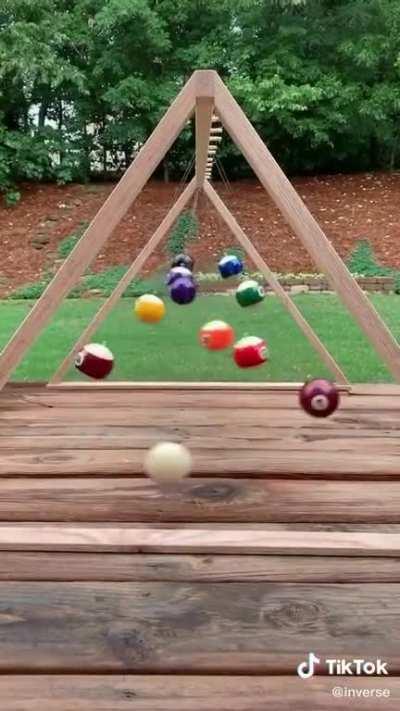 Pool ball pendulum