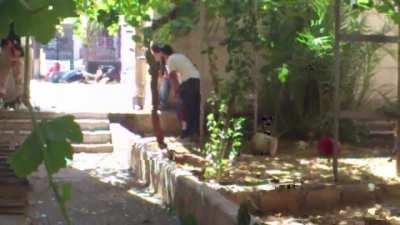 Liwa al-Tawhid fighters brave incoming fire to recover the body of a fallen comrade - Sayf al-Dawla, Aleppo - 8/23/2012