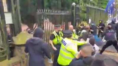 Staff of Chinese consulate in Manchester destroys Hong Kong protest signs and drags protesters into consulate to beat them up