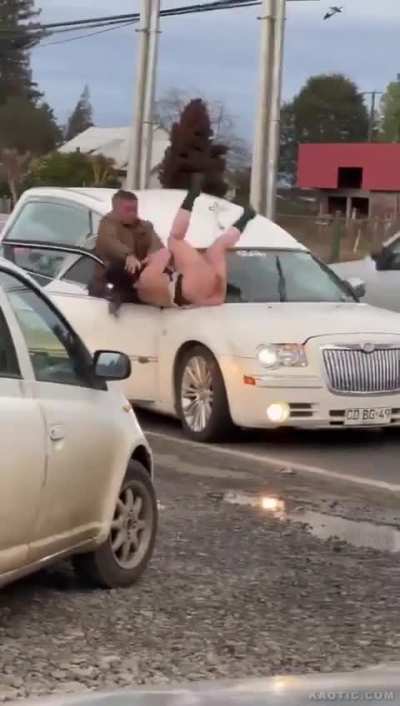 Semi-naked maid riding a hearse. 