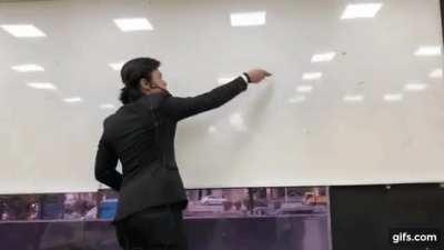 Man draws circle on whiteboard