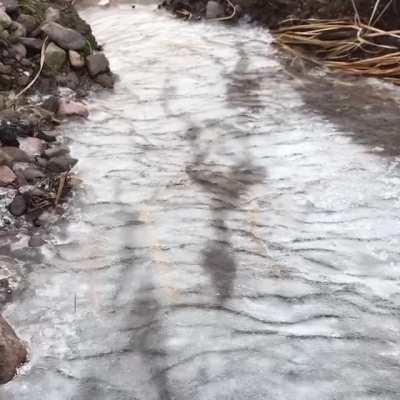 The ice thawing underneath this frozen stream looks like evil spirits trying to escape