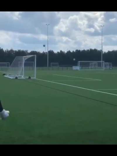 Luton Town's Harry Isted scoring for way behind the goal.