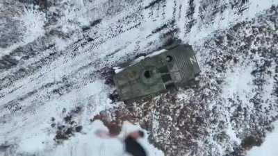 A Ukrainian drone destroying a Russian BMP-1 with a grenade