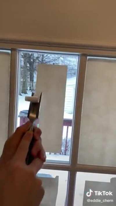 Removing paint from a window