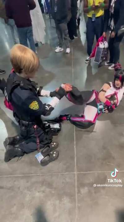 Cosplayer getting her feet cleaned