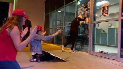 Women trying to pray a Trump victory outside election department in Las Vegas.