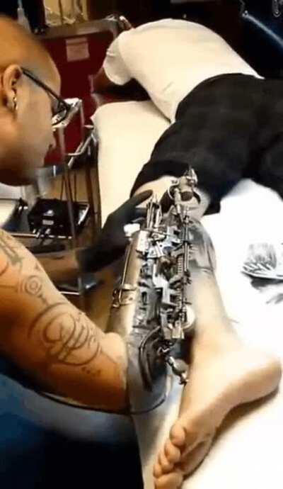 This dope tattooist and his bionic arm